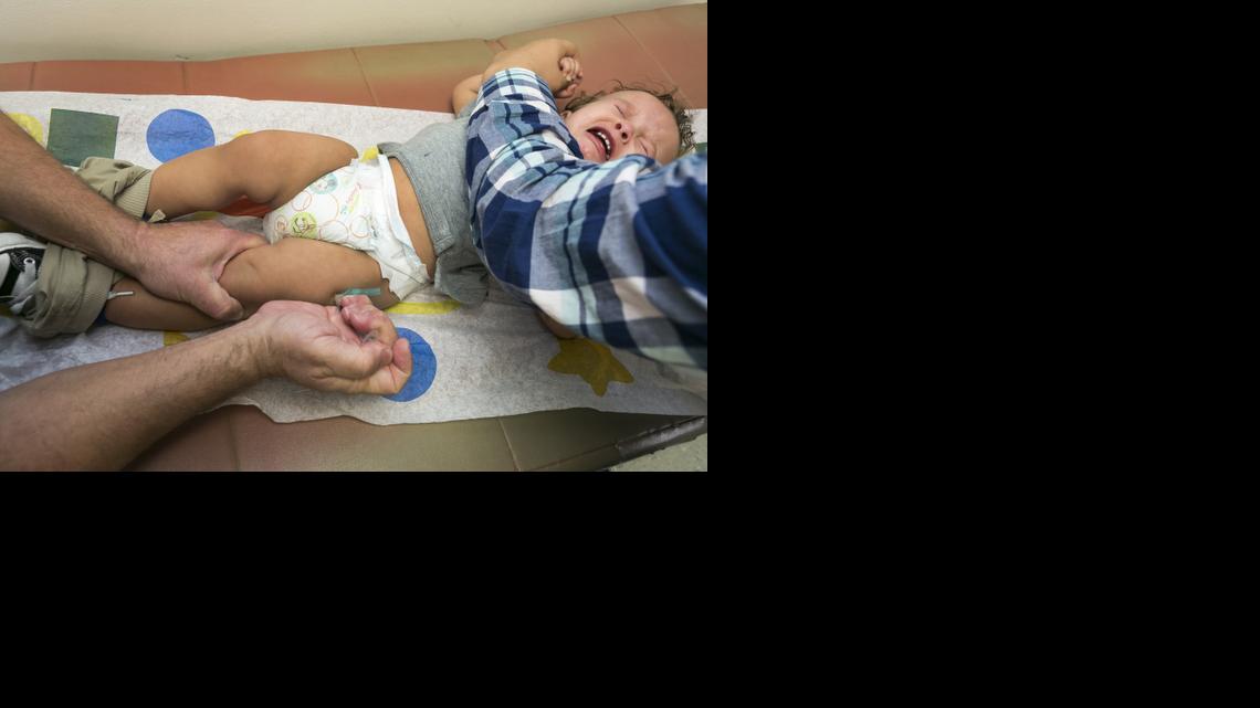 
Pediatrician Charles Goodman vaccinates 1 year- old Cameron Fierro with the measles-mumps-rubella vaccine, or MMR vaccine at his practice in Northridge, Calif., Thursday, Jan. 29, 2015. 
