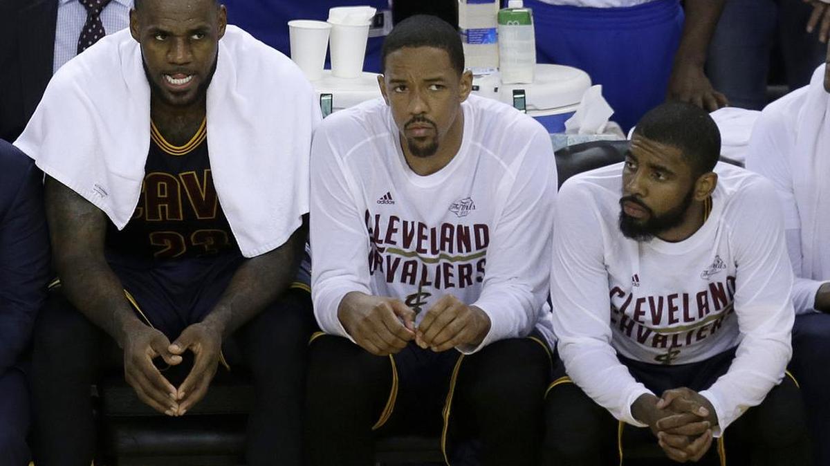 Cleveland Cavaliers forward LeBron James, from left, sits on the bench with center Tristan Thompson and guard Kyrie Irving during the second half of Game 1 of basketball's NBA Finals against the Golden State Warriors in Oakland, Calif., Thursday, June 1, 2017.
