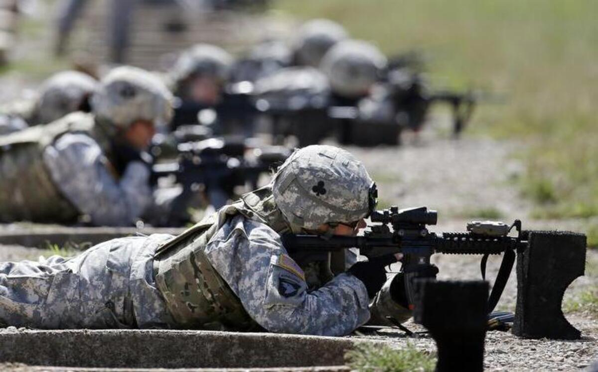 In this Sept. 18, 2012, photo, female soldiers train on a firing range while wearing new body armor in Fort Campbell, Ky. Members of the U.S. special operations forces say that allowing women to serve in Navy SEAL, Army Delta or other commando units could hurt their effectiveness, lower the standards and drive men away from the jobs.