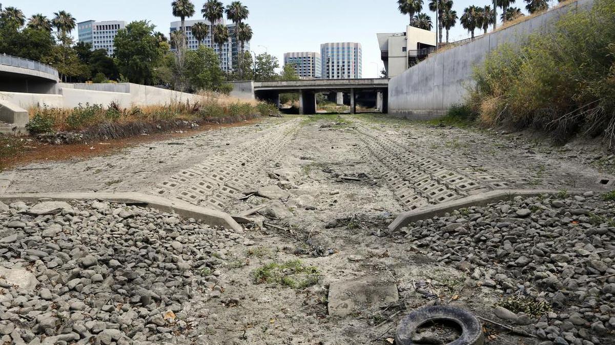 
Looking south, one can see the dried up Guadalupe River near Santa Clara Street in San Jose, Calif., on July 17, 2015.
