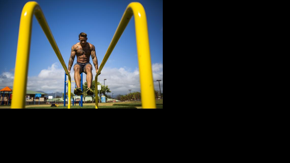 
Army Sgt. Shane Ortega works out at a park in Mililani, Hawaii. 
