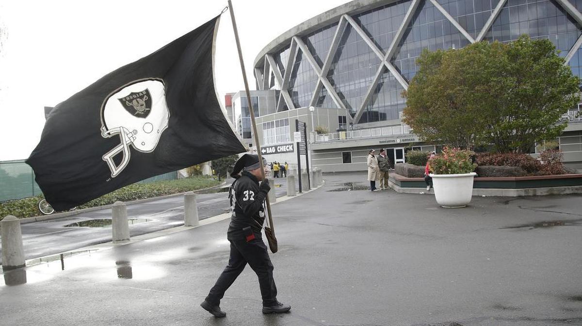 An Oakland Raiders fan tailgates at O.co Coliseum in Oakland, Calif., Thursday, Dec. 24, 2015. Oakland ranked 39th on the list of best football cities.