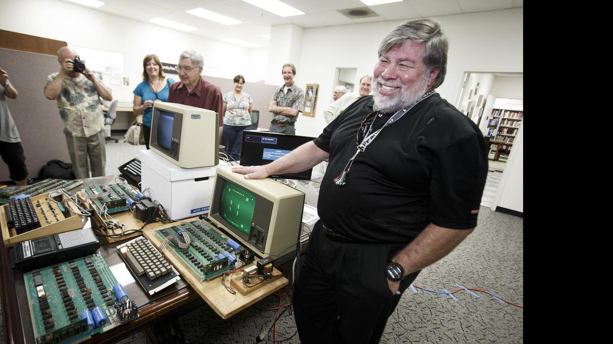 
Steve Wozniak, co-founder of Apple, poses behind five Apple 1 computers in 2013 at History San Jose in Calif. 
