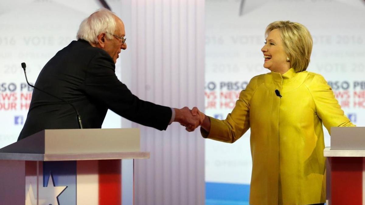 Democratic presidential candidates, Sen. Bernie Sanders, I-Vt, and Hillary Clinton shake hands after a Democratic presidential primary debate at the University of Wisconsin-Milwaukee Thursday.