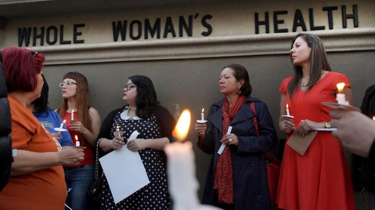 In this March 6, 2014 file photo, people hold a candlelight vigil in front of the Whole Woman's Health Clinic in McAllen, Texas. The clinic is part of a Supreme Court challenge to a Texas law.