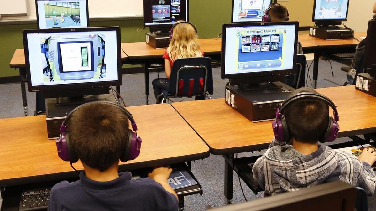 
Students at a summer reading academy at Buchanan elementary school work in the computer lab at the school in Oklahoma City. Results for some of the states that participated in Common Core-aligned testing for the first time this spring are out, with overall scores higher than expected though still below what many parents may be accustomed to seeing. 
