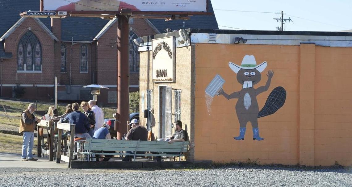 The Thirsty Beaver in a photo from 2015. The bar had plenty of open space around it then. The church in the background was demolished to make way for the new apartments that now are surrounding the Thirsty Beaver.