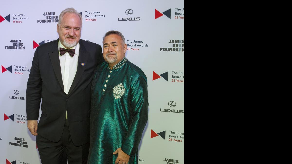 
Chef Art Smith, left, and Jesus Salgueiro arrive at the 2015 James Beard Awards at Lyric Opera of Chicago on Monday.
