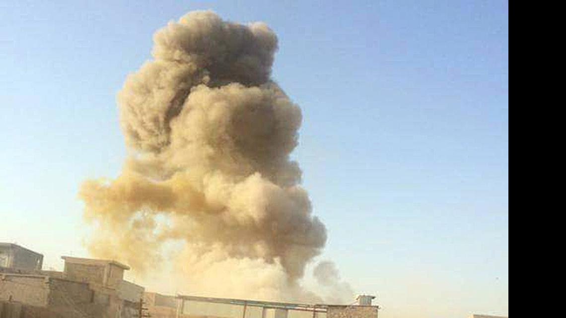 
A car bomb explodes at the gate of a government building near the provincial governor’s compound in Ramadi, Iraq, on May 16, 2015. Ramadi is now controlled by the Islamic State.
