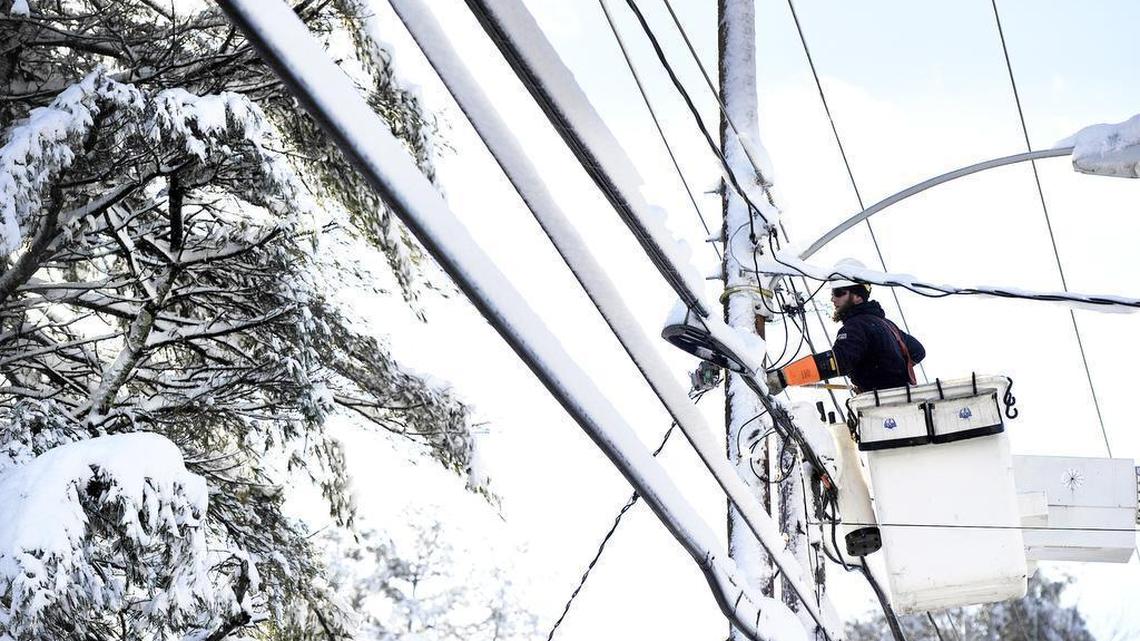 Justin Voight of On Target Utility works to restore power to a home in Cumberland, Maine, on Friday, Dec. 30, 2016. A code associated with the Russian hacking operation dubbed Grizzly Steppe by President Barack Obama's administration has been detected within the system of a Vermont utility, according to U.S. officials.