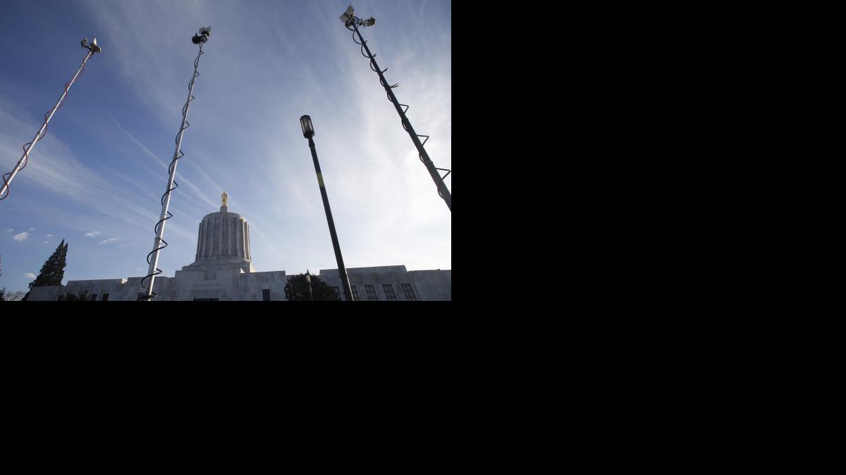 
The Capitol Rotunda is framed by television news crew microwave broadcasters, in Salem, Ore., on Thursday, Feb. 12, 2015. 
