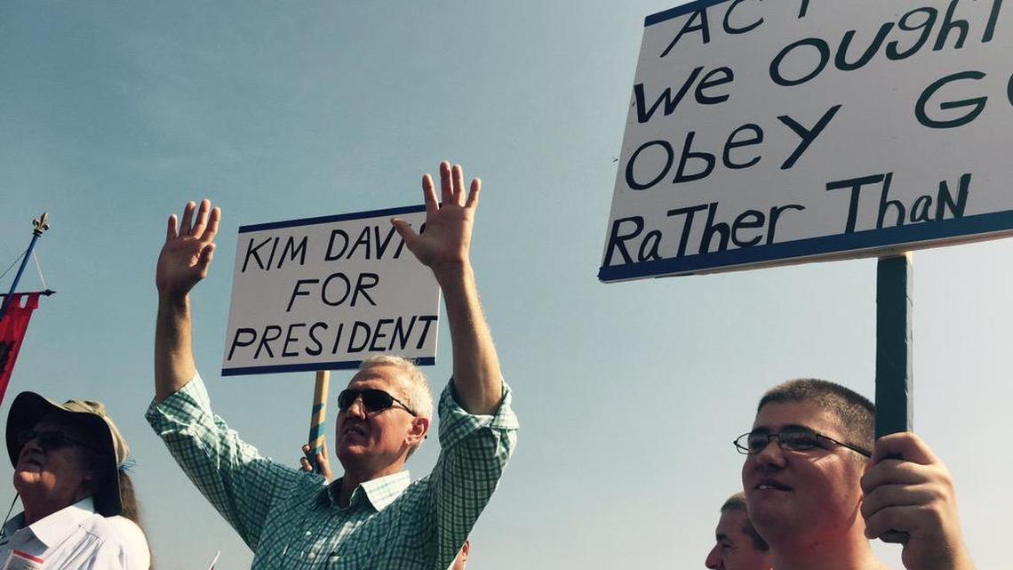 
Supporters of Rowan County Clerk Kim Davis hold up signs in support of her, outside the Carter County Detention Center, Sept. 5, 2015, in Grayson, Ky. Davis stopped issuing marriage licenses to any couple, gay or straight, in defiance of a federal court order, and was sent to jail on Thursday. 
