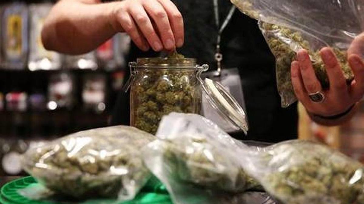 Assistant manager Dunn Ericson refilled a jar of medical marijuana at the River Rock Medical Marijuana Center in Denver, Colorado, on May 16, 2013.