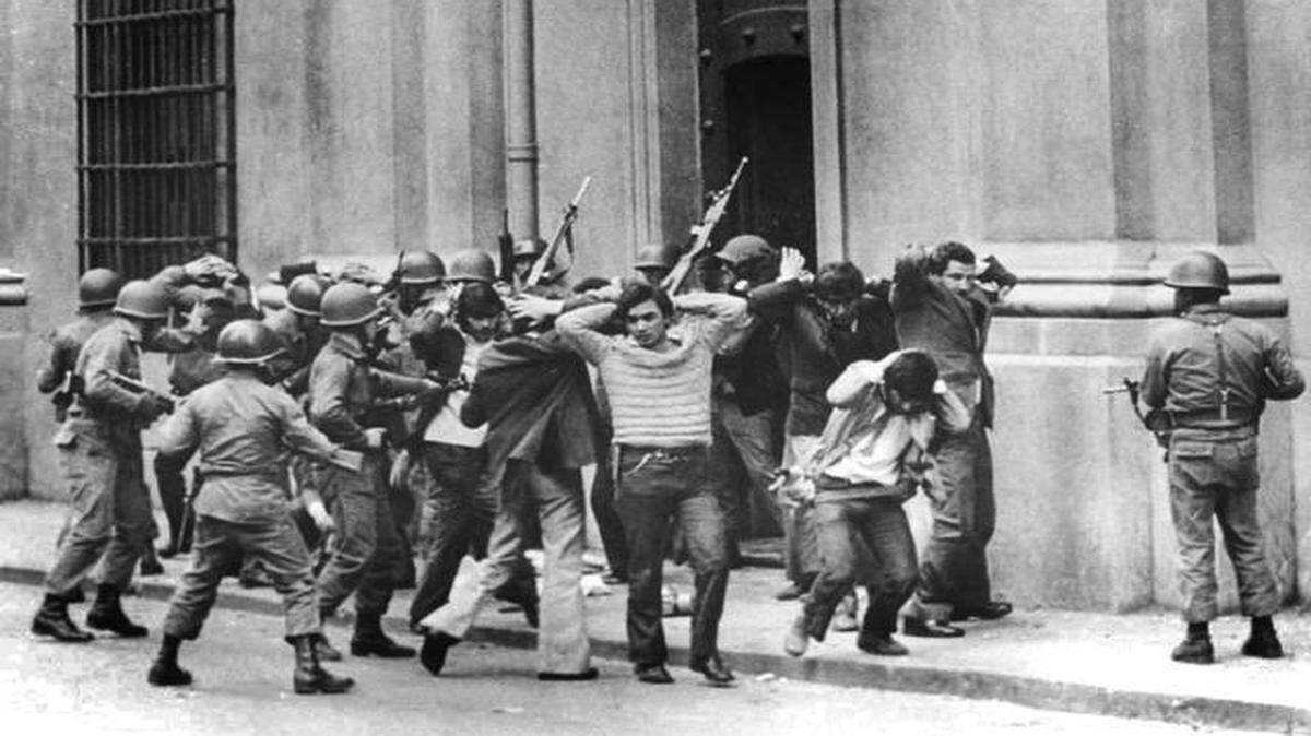 
This photo taken almost 42 years ago shows troops rounding up loyalists to President Salvador Allende. Gen. Augusto Pinochet, with help from the Nixon administration, toppled an elected leader and ruled from 1973 until 1990. Victims of repression under the Pinochet regime continue to seek justice through Chilean courts. Jaime Garcia Covarrubias, a member of Pinochet’s brutal secret police who’s been accused of murder, taught for more than a decade at the Pentagon’s premier university, despite repeated complaints by his colleagues about his past. He is charged in criminal court in Santiago with being the mastermind in the execution-style slayings of seven people in 1973, according to court documents.
