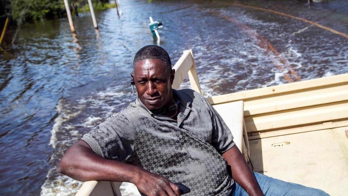 Jeff Linnen gets a ride from the National Guard through flood waters in the Dunbar community of Georgetown, S.C., on Friday, Oct. 9, 2015, where the roadway is barely visible below the water. South Carolina is still working on road repairs from the flooding, and has deeper underlying road problems. (Jason Lee/The Sun News via AP)