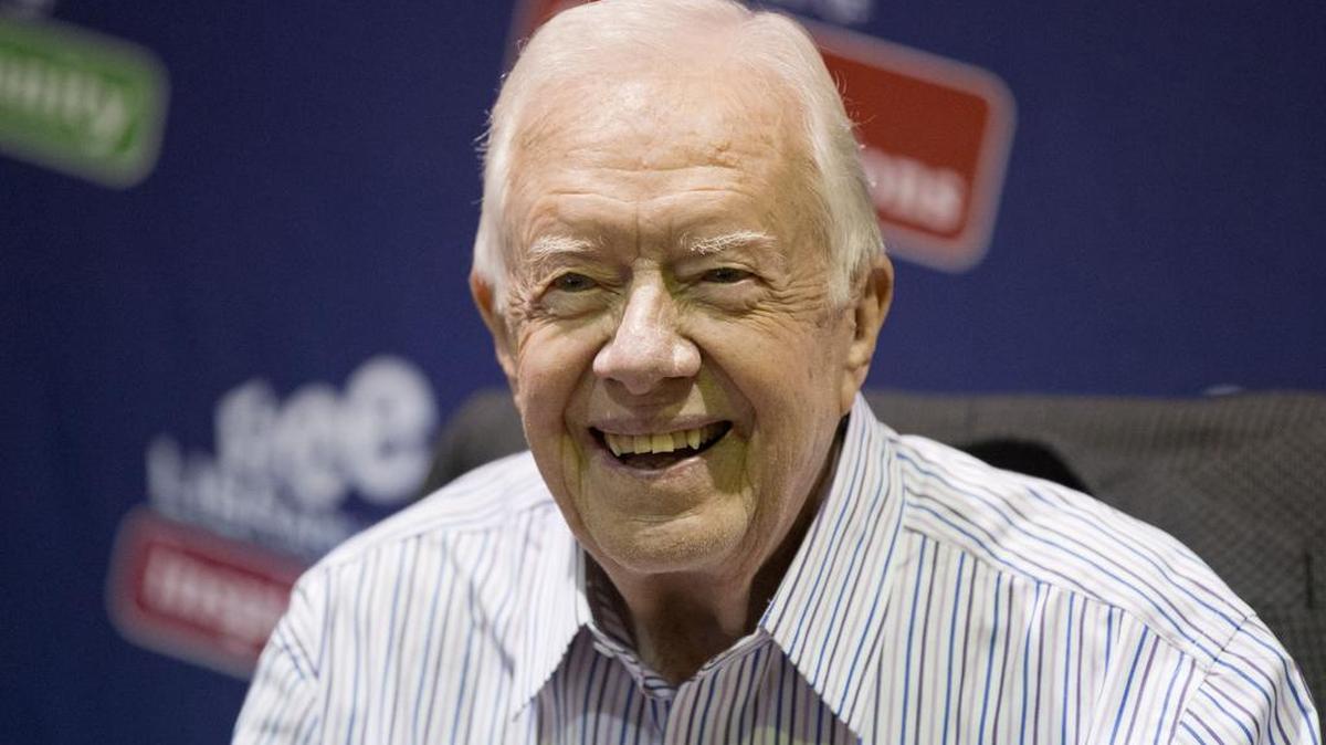 
Former President Jimmy Carter poses for photographs at an event for his new book, “A Full Life: Reflections at Ninety” on July 10, 2015, at the Free Library in Philadelphia.

