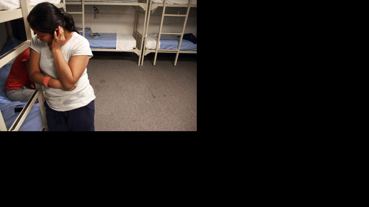 
An unidentified Guatemalan woman is seen inside a dormitory in the Artesia Family Residential Center, a federal detention facility for undocumented immigrant mothers and children in Artesia, N.M., on Sept. 10, 2014. Since July, more than 2,500 immigrants, mostly women and children, have been detained at four family detention centers. 


 
