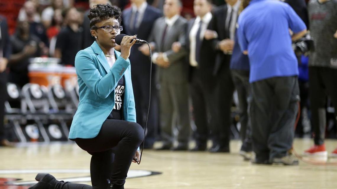 Denasia Lawrence sings the national anthem before an NBA preseason basketball game between the Miami Heat and the Philadelphia 76ers, Friday, Oct. 21, 2016, in Miami.