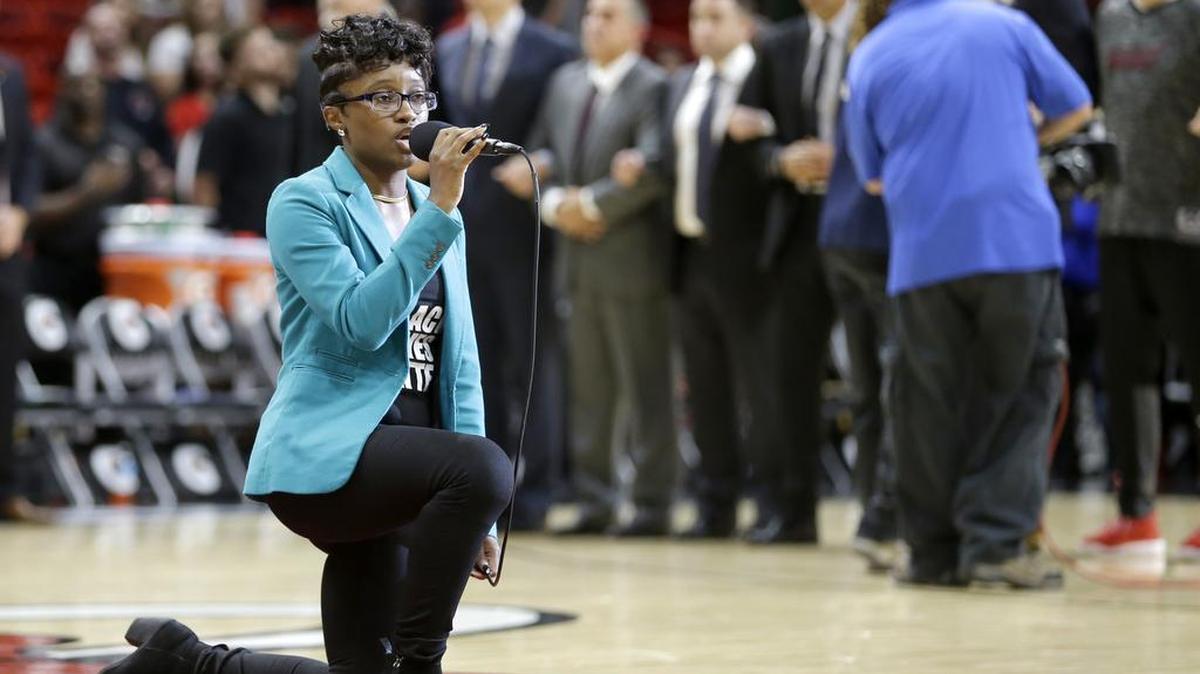 Denasia Lawrence sings the national anthem before an NBA preseason basketball game between the Miami Heat and the Philadelphia 76ers, Friday, Oct. 21, 2016, in Miami.