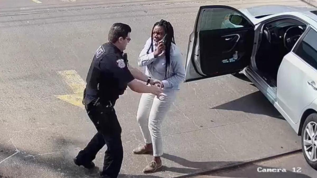 In this image from a video released by The Fertitta Reynal Law Firm, a Houston police officer arrests Earledreka White on charges of resisting arrest during a traffic stop in March.
