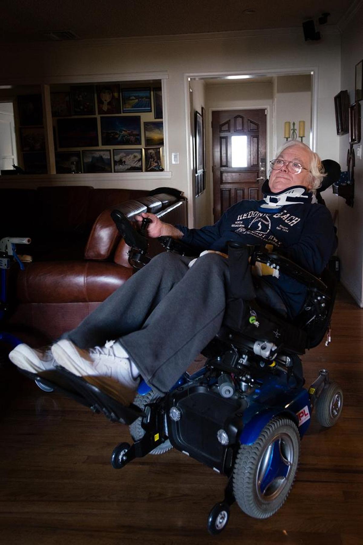 Colin Campbell at his home in Covina, Calif., on Dec. 18, 2017. Campbell was diagnosed with ALS eight years ago. He has Medicare due to his disability but can't use it for home care and instead is paying $4,000 a month for that service. His adjustable wheelchair allows him to recline, which makes breathing easier.
