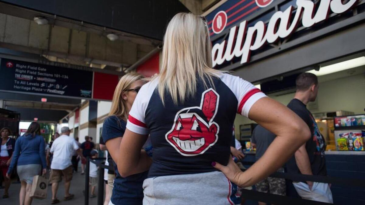 A fan waits in line for concessions at Progressive Field in Cleveland.
