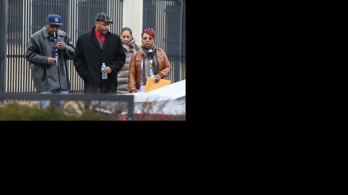 
Michael Brown’s mother, Lesley McSpadden, far right, leaves the FBI offices in St. Louis after meeting with federal officials on Wednesday. The Justice Department won’t prosecute a former Ferguson, Mo., police officer in the shooting death of Michael Brown, but in a scathing report released Wednesday, faulted the city and its law enforcement for racial bias and unconstitutional practices.
