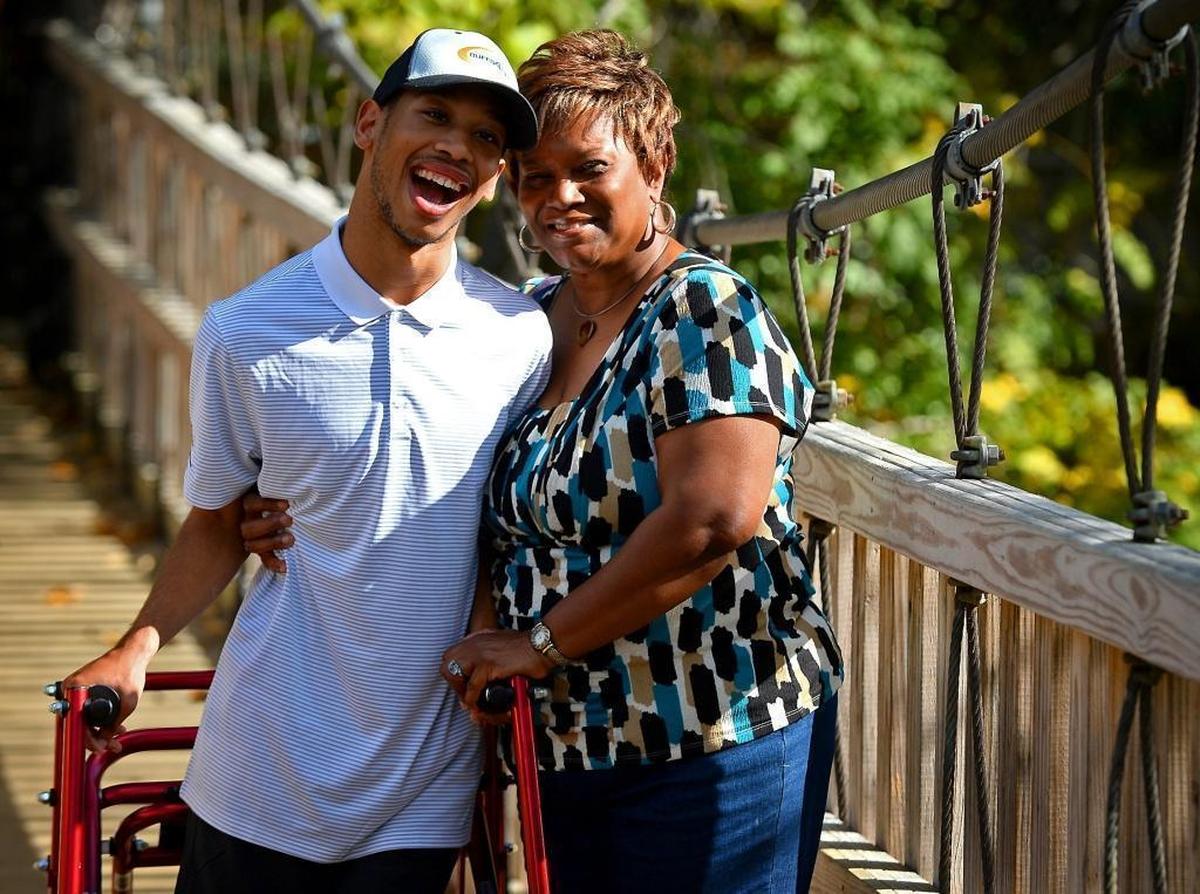Chancellor Lee Adams, left, and his grandmother Saundra Adams on a bridge at Freedom Park in Charlotte in early November 2017. Due to the generosity of friends and strangers and an organization called Buffs 4 Life, the Adamses moved into a new house this year in Charlotte.
