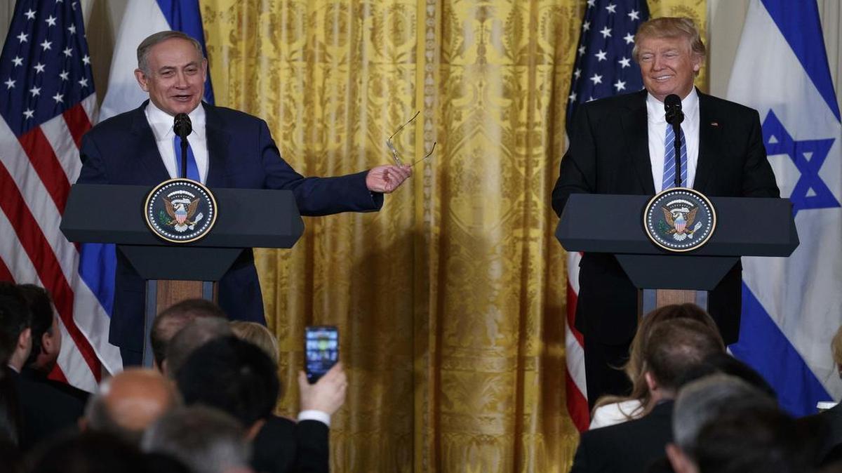 FILE - In this Wednesday, Feb. 15, 2017 file photos, President Donald Trump listens as Israeli Prime Minister Benjamin Netanyahu speaks during their joint news conference in the East Room of the White House, in Washington. Trump and Netanyahu said at their first joint news conference that they will seize what they believe is an opportunity for an ambitious Israeli-Arab peace deal.
