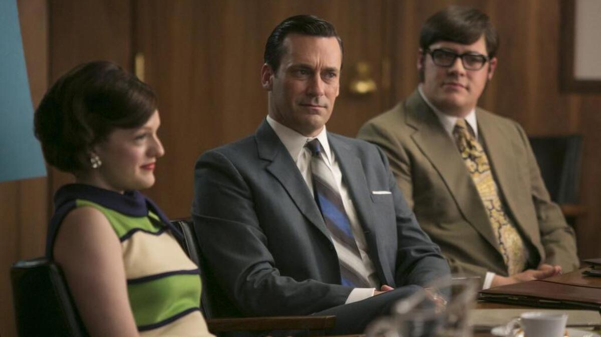 Elisabeth Moss, from left, Jon Hamm and Rich Sommer appear in a scene released by AMC from "Mad Men," the plot lines of which often exposed workplace bias.
