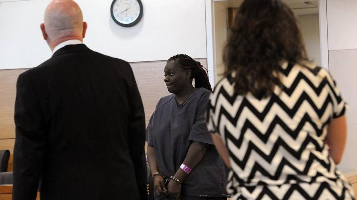 Keishanna Thomas arrives in Judge Diana Moreland's court Tuesday morning. Thomas is being held in contempt of court and refuses to say what happened to her daughter, Janiya, 11.