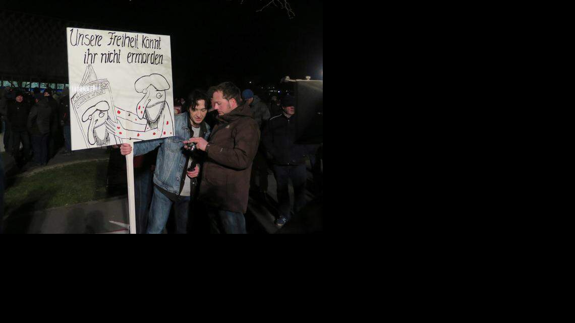 Peter Schmidt from Klingenthal, Saxony, holds a sign saying "You cannot kill our freedom," which he said was an homage to Charlie Hebdo, on Monday, Jan. 12, 2015, at a rally in Dresden. (Claudia Himmelreich/McClatchy DC/TNS)