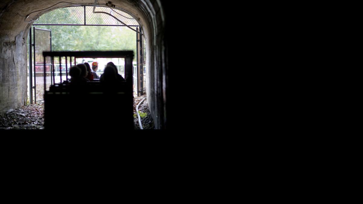 
 A worker drives a rail car while conducting a tour of the Portal 31 coal mine, which has been turned into a tourist attraction in Lynch, Ky. Many areas in Central Appalachia are at an economic crossroads, as mining and logging give way to services jobs. 
