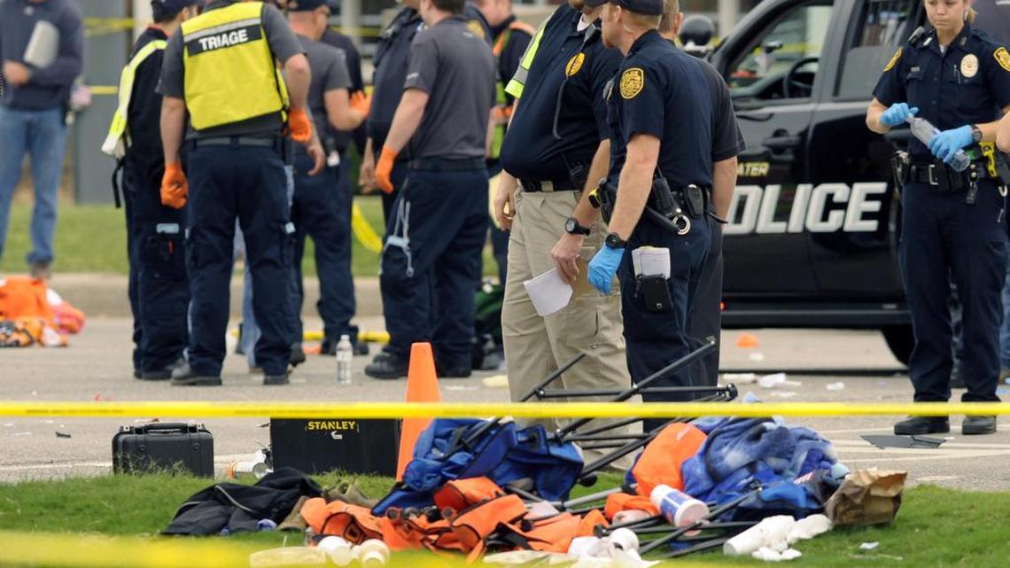 Police investigators look over the scene after a vehicle crashed into a crowd of spectators during the Oklahoma State University homecoming parade, causing multiple injuries, on Saturday, Oct. 24, 2015 in Stillwater, Okla.