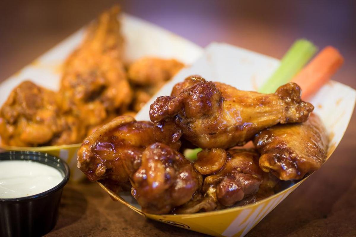 The many sauces available at Buffalo Wild Wings tend to seem more like masks that enhancements.