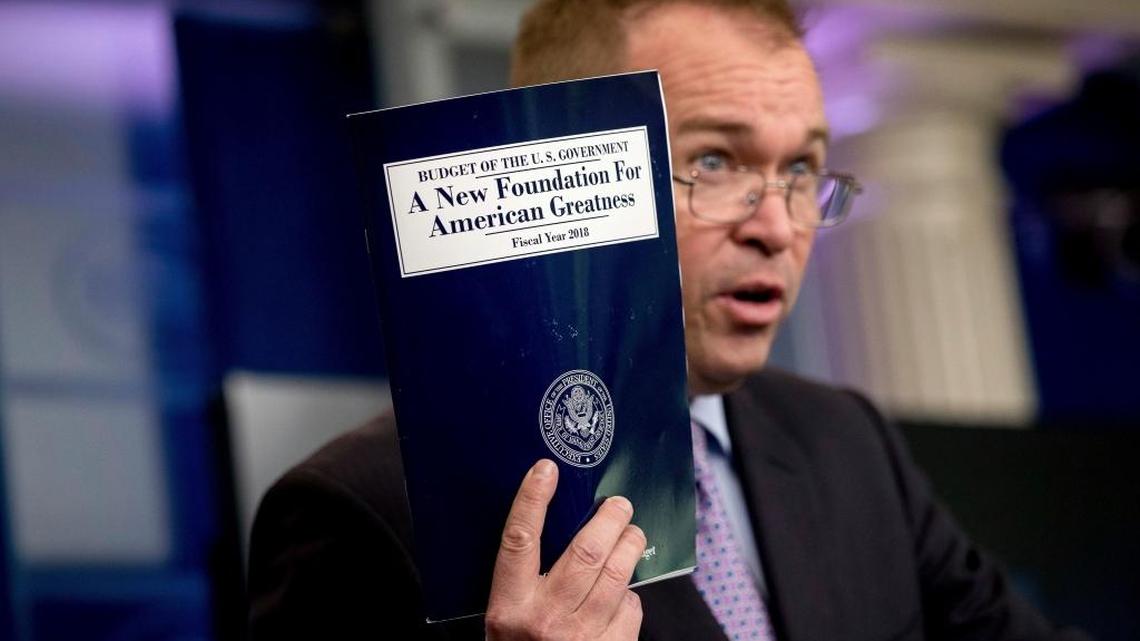 In this May 23, 2017, photo, Budget Director Mick Mulvaney holds up a copy of President Donald Trump's proposed fiscal 2018 federal budget as he speaks to members of the media in the Press Briefing Room of the White House in Washington. Trump’s $4.1 trillion plan for the budget year beginning Oct. 1 generally proposes deep cuts in safety net programs, including the Supplemental Nutrition Assistance Program, or SNAP, commonly known as food stamps.