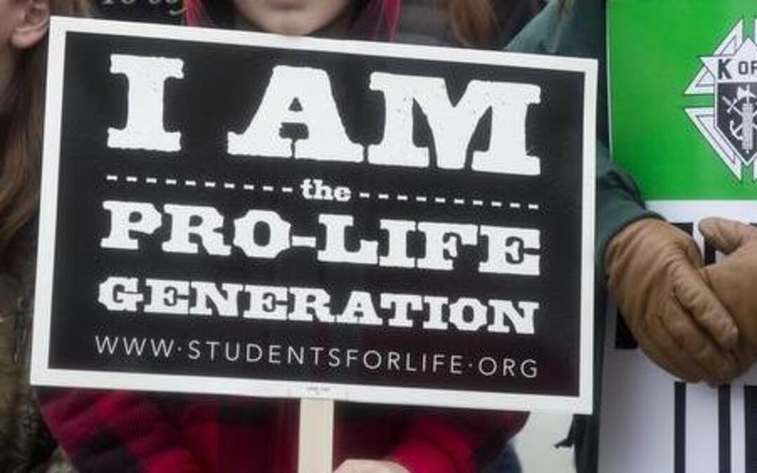 Eric Burke, 12, center, came to the annual Idaho March for Life Jan. 21 with his mother, Melissa Burke, and Kayla, 10. The national group Students for Life isn't dropping its "pro-life" label altogether. Their trademark posters will appear again at this year's March for Life on Friday, stating "I am the pro-life generation."