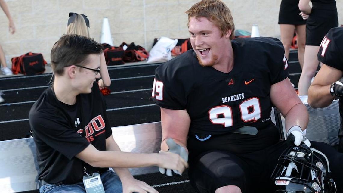 Hunter Cartwright, left, shares a moment with his friend Wes Harris at this year’s homecoming game at Aledo High School.