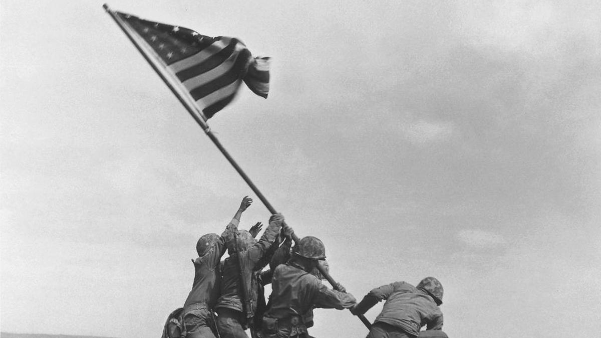 This is a file photo from Feb 23, 1945 file photo, of U.S. Marines of the 28th Regiment, 5th Division, raise the American flag atop Mt. Suribachi, Iwo Jima, Japan.