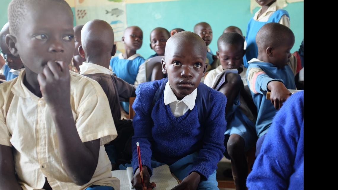 
Barack Obama Okoth, a student at Senator Barack Obama Primary School in Kogelo, Kenya, takes notes on June 17, 2015. Obama is making his first visit to Kenya next month, and many wonder whether he will return to his father’s village. 
