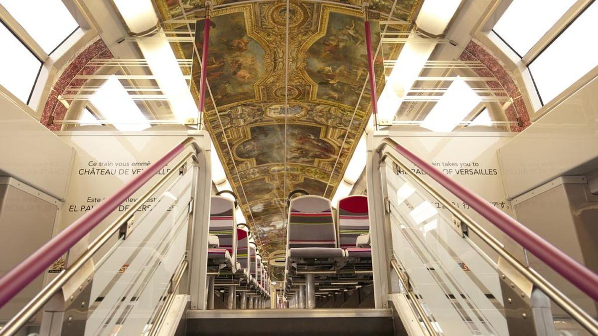 One of the Art in Transit trains features artwork meant to resemble the Palace of Versailles.
