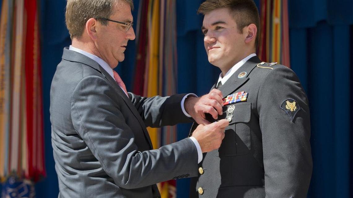 
Defense Secretary Ash Carter, left, awards Oregon National Guardsman Alek Skarlatos with the Soldier's Medal during a ceremony at the Pentagon on Sept. 17, 2015. Skarlatos, one of three Americans hailed as heroes for stopping a terrorist attack on a Paris-bound train in August, would have been at the Oregon college where a gunman killed nine people if he had not been in Los Angeles to rehearse for ABC's "Dancing With the Stars." 
