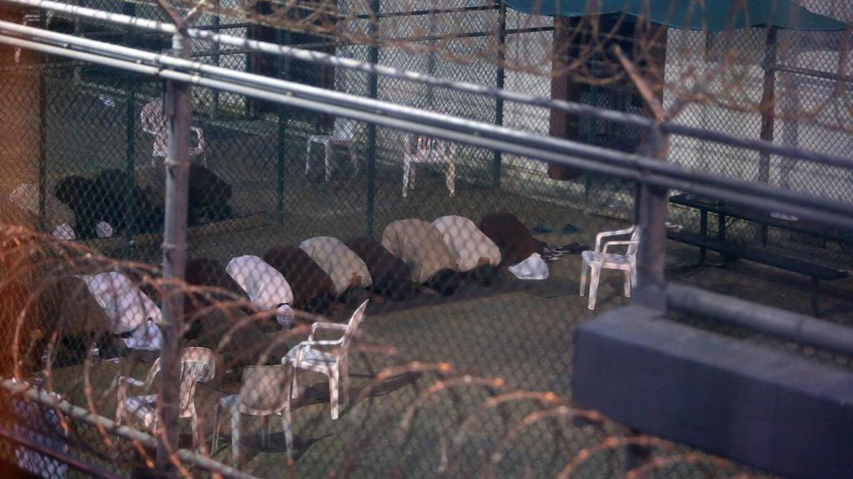 Detainees conduct evening prayers at the Camp 6 prison building for cooperative captives at the U.S. Navy Base at Guantanamo Bay, Cuba, on Tuesday, July 7, 2015. Former detainee Mohammed Abu Wa’el Dhiab started a hunger strike while at Guantanamo. The videotapes of his being force-fed span some 11 hours, but have not yet been released by the government.