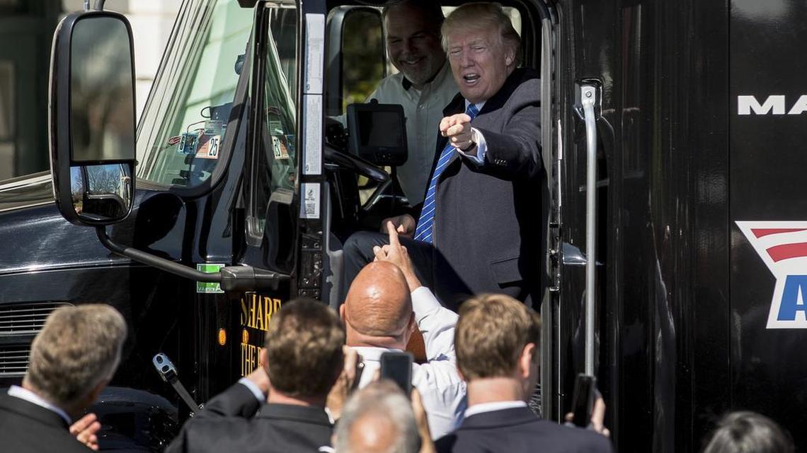 President Donald Trump sits in an 18-wheeler truck while meeting with truckers and CEOs at the White House on March 23, 2017.