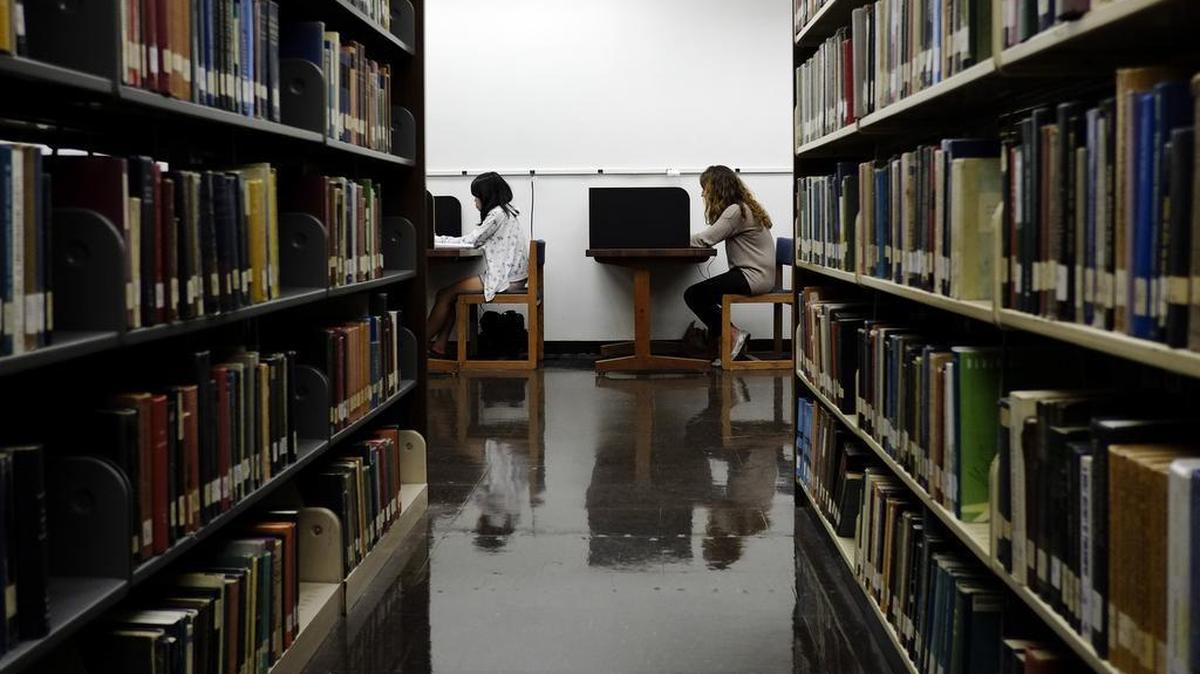 In this Friday, Oct. 19, 2012 photo, students study in a library on the campus of California State University, Long Beach in Long Beach, Calif.