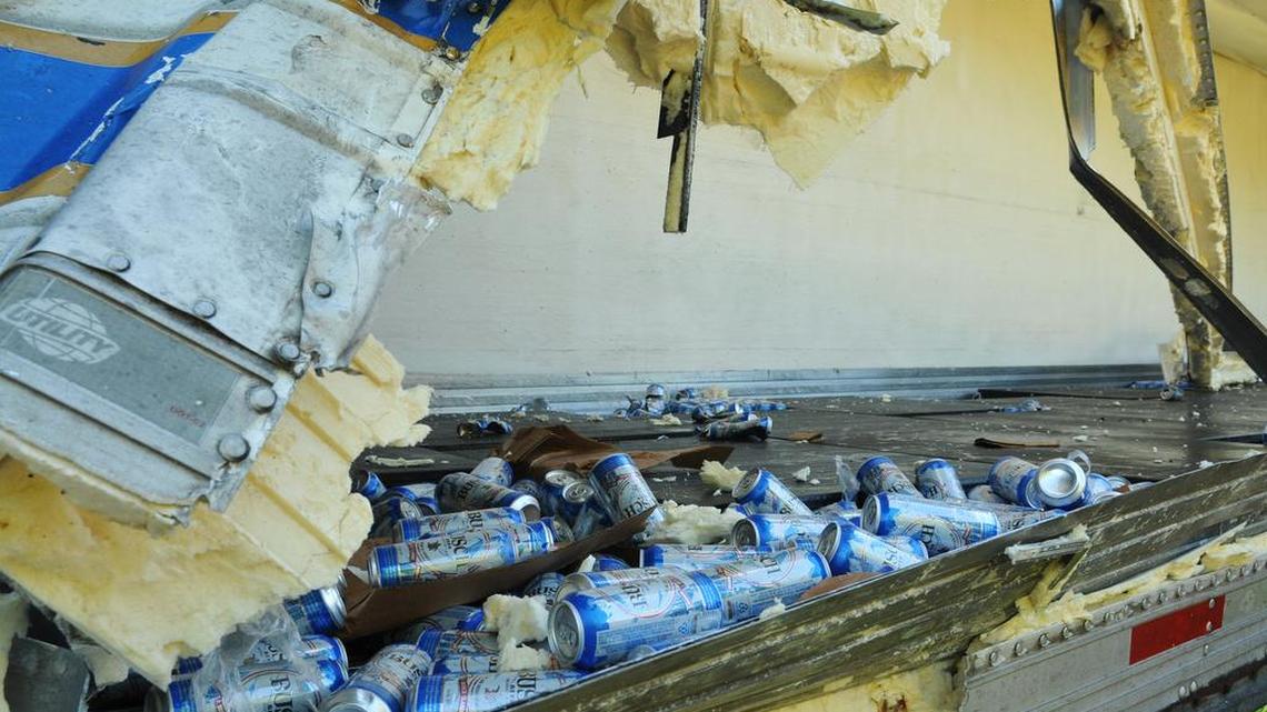 A truck hauling Busch beer is damaged after colliding with a truck carrying Frito Lay chips on southbound 1-95 near Melbourne, Fla.,on Wednesday, March 23, 2016. The Florida Highway Patrol says the Frito Lay truck was stopped on the shoulder when the Busch beer truck struck it.