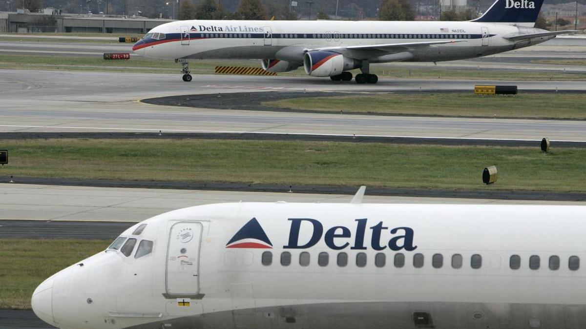 Delta Air Lines jets line up on the tarmac at Hartsfield-Jackson Atlanta International Airport in Atlanta, Ga., in this Nov. 22, 2006, file photo. Delta Flight 1943 from Detroit to Atlanta was delayed Saturday December 30, 2017, after a bird flew into the cockpit.