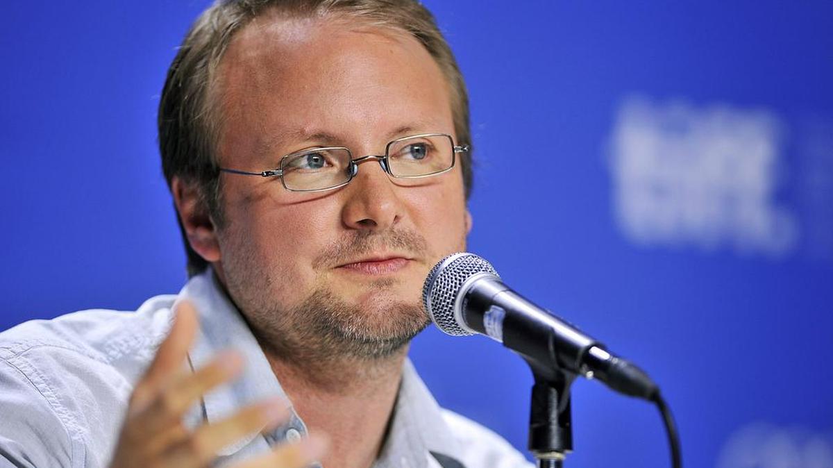 Writer-director Rian Johnson speaks about his movie “Looper” during a news conference at the 2012 Toronto International Film Festival in Toronto. A former agent for the director of the next “Star Wars” film is suing claiming he was cut out of negotiations regarding the blockbuster franchise. Agent Brian Dreyfuss sued Johnson in Los Angeles Superior Court on Friday, March 18, 2016, seeking 10 percent of the director’s “Star Wars” earnings.