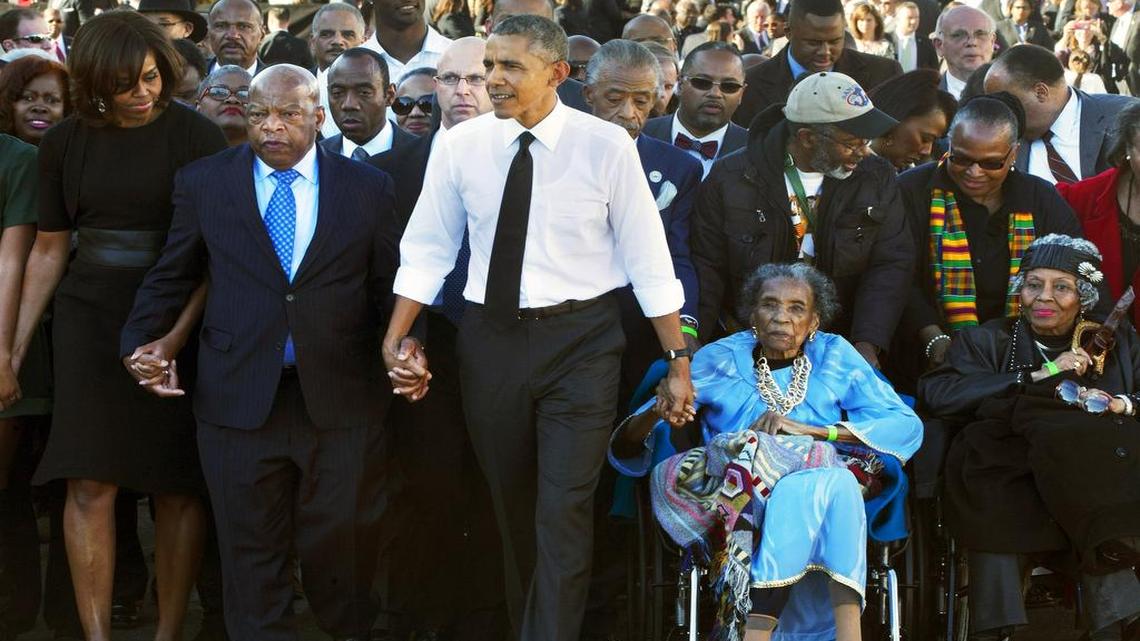 
In this March 7, 2015, photo, President Barack Obama, center, holds hands with Rep. John Lewis, D-Ga., left, and Amelia Boynton Robinson, right, who were both beaten during “Bloody Sunday,” as they walk across the Edmund Pettus Bridge in Selma, Ala., for the 50th anniversary of “Bloody Sunday.” Boynton Robinson, a civil rights activist who nearly died while helping lead the Selma march, championed voting rights for blacks, and was the first black woman to run for Congress in Alabama, died Wednesday, Aug. 26, 2015. She was 104.
