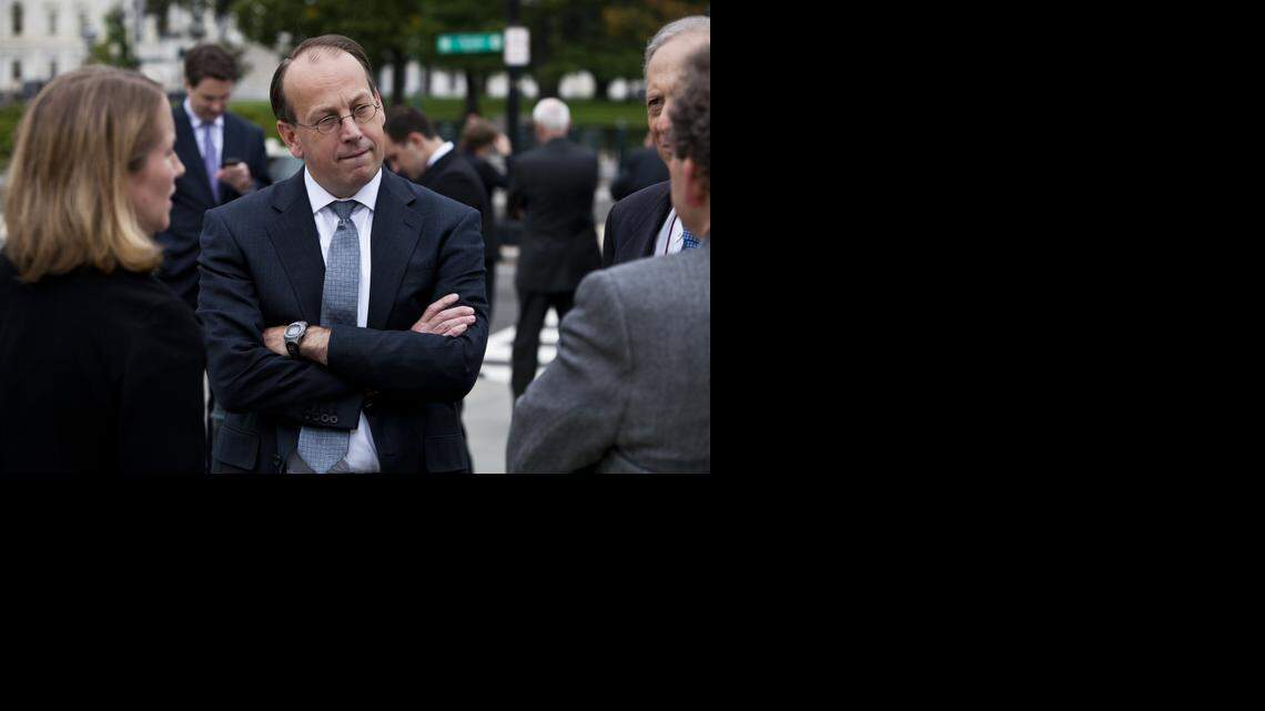 
Paul Clement, a former solicitor general in the Bush administration, speaks with fellow attorneys outside the Supreme Court building in Washington, Oct. 11, 2011. After Clement’s law firm dropped the case rather than defended the federal Defense of Marriage Act before the Supreme Court, he changed firms so as to be able to continue to represent the clients.
